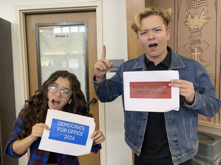 Maddie Leiva (‘27) and Gavin Hamilton (‘27) dramatically pose while holding signs promoting the democratic and republican parties respectively. The two students are both expressing dismay for each other's signs, however situations such as this disagreement are encouraged at Webb. “It's important to keep people in your life that you disagree with, because it kind of affirms what you really believe in,” Saraya Chigoji (‘27) said. Moments of debate build stronger individuals who can allow political differences to coexist. 